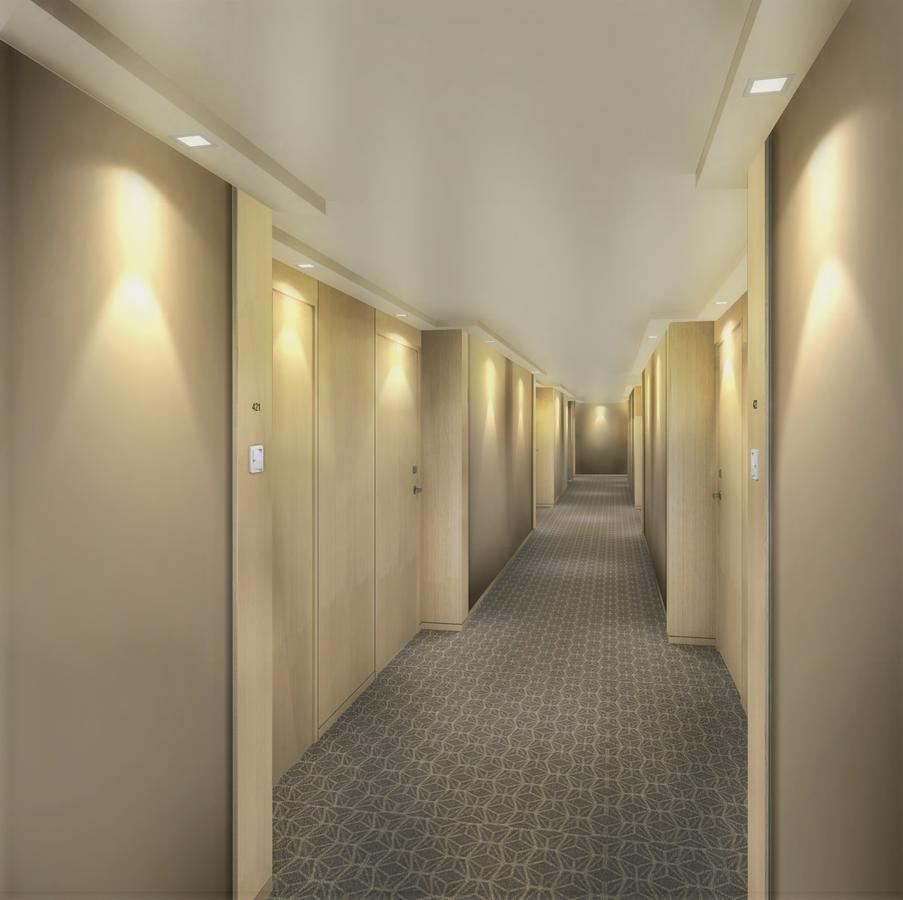 Seda Vertis North Quezon City Extérieur photo A typical hotel corridor